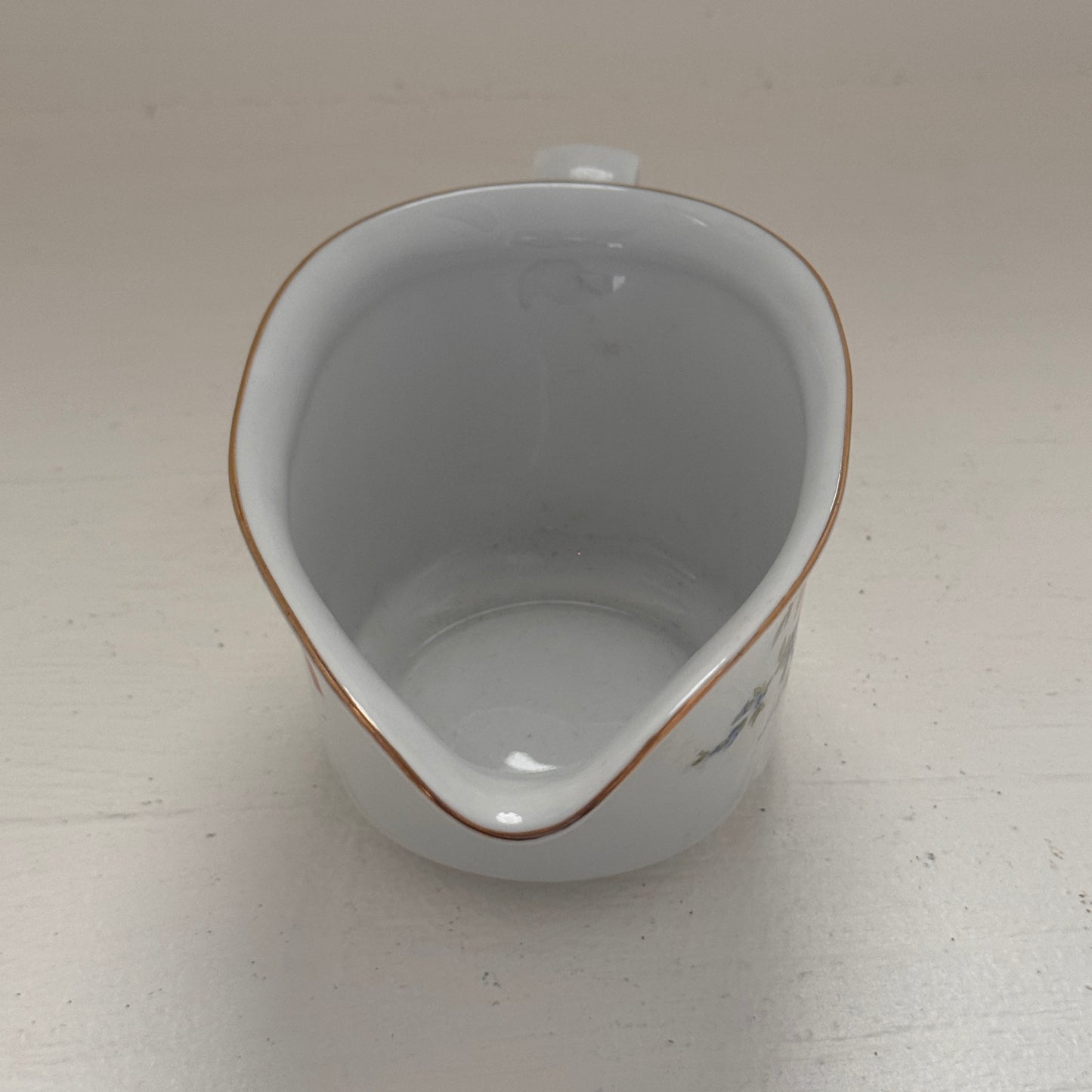 Floral gravy boat made in Germany Point 12 LBS 8 in length 4 inches wide 3 1/4 inches tall