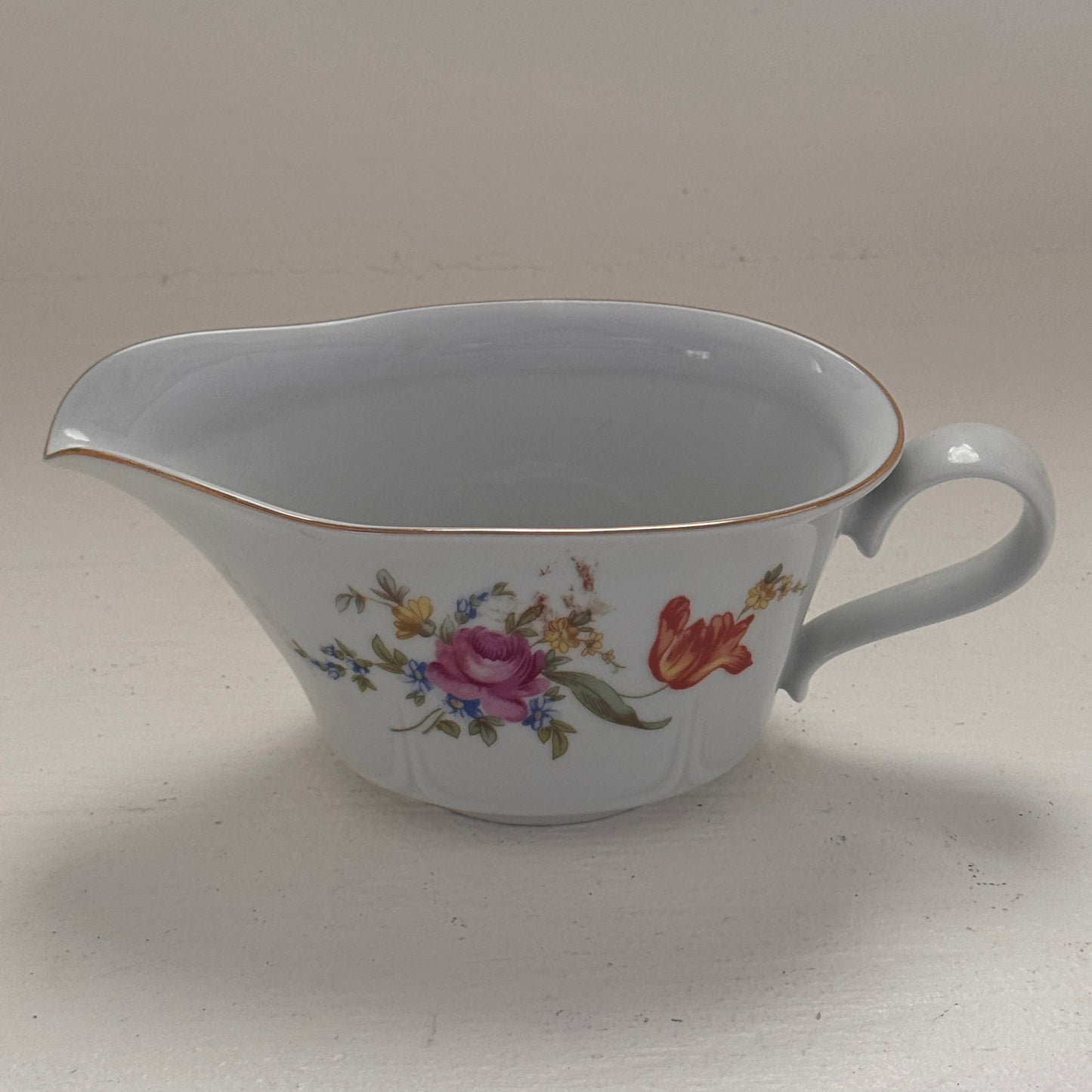 Floral gravy boat made in Germany Point 12 LBS 8 in length 4 inches wide 3 1/4 inches tall