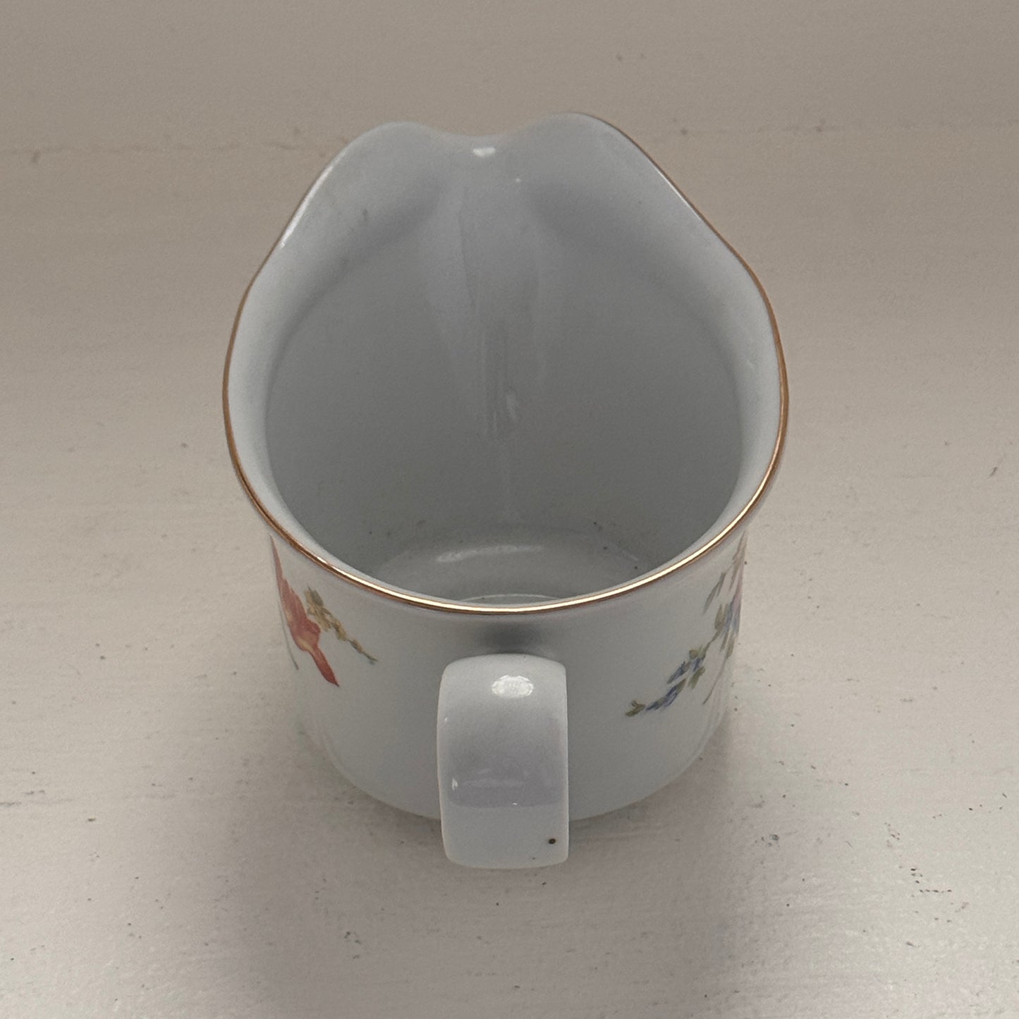 Floral gravy boat made in Germany Point 12 LBS 8 in length 4 inches wide 3 1/4 inches tall